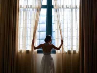 Bride looking out a window at the Phoenixville Foundry