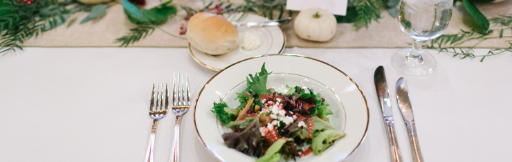 Plated salad at a holiday party by Queen of Hearts Catering